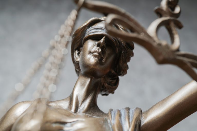 close-up of Lady Justice or Justitia statue as a symbol for law and legal topics